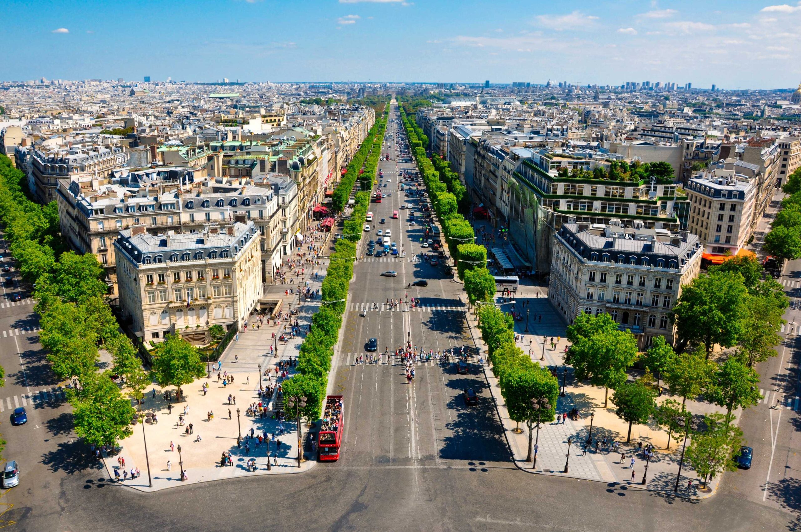 View of Champs-Elysées from the Arc de Triomphe with view of road to show importance of car rental excess insurance.